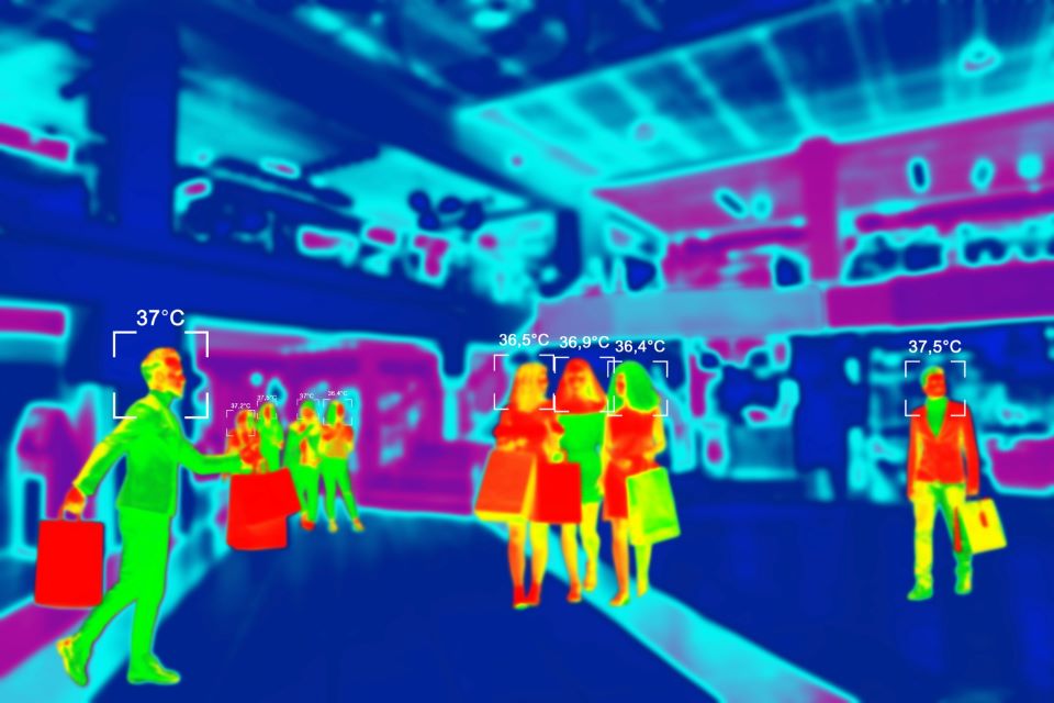 People in colorful thermal scan with celsius degree temperature